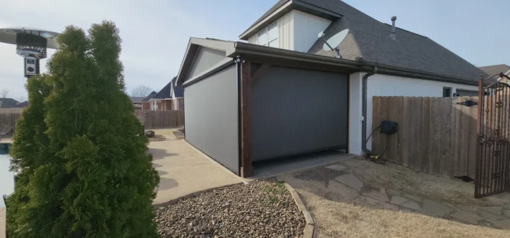 Bronze housing fixed screen and Gable Nano 99 Granite texture complete privacy shades